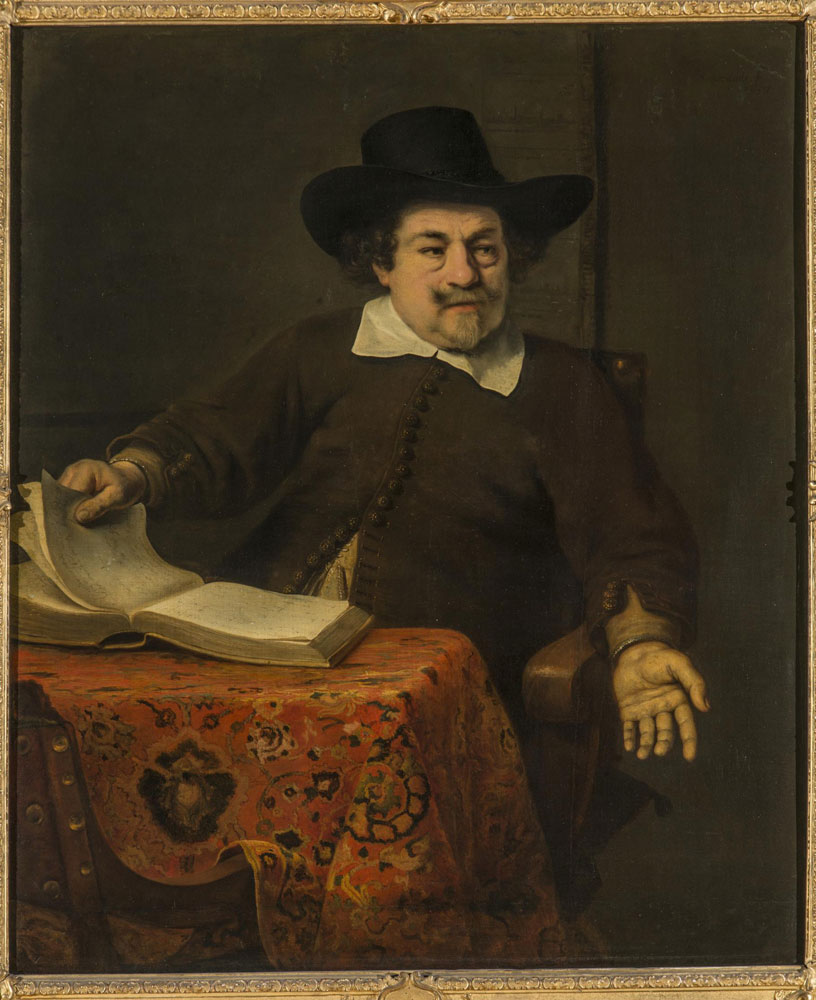 Ferdinand Bol - Portrait of a man with a hat at a table