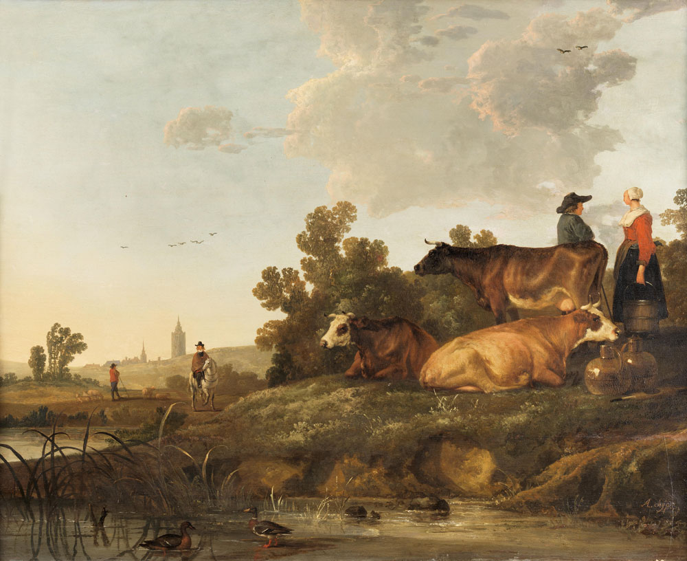 Circle of Aelbert Cuyp - A drover and milkmaid standing beside cattle, a view to a town in the distance
