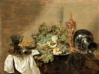 Abraham Hendricksz. van Beijeren Grapes and a peeled lemon in a basket with bread, dressed crab and a roemer of wine on pewter plates, together with a gilt cup and cover, and a pewter flagon upon a draped table-top