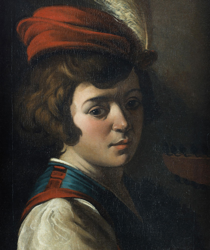 Studio of Lionello Spada - A young boy in a red feathered hat