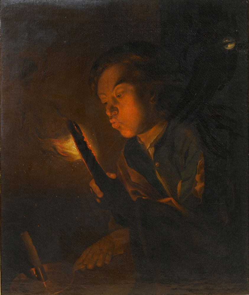 After Godfried Schalcken - A boy blowing on the embers of a piece of wood